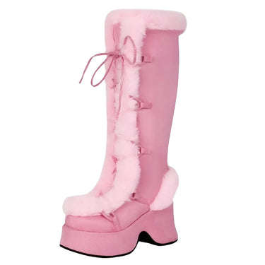 Pink knee-high boots with fur lining on a white background